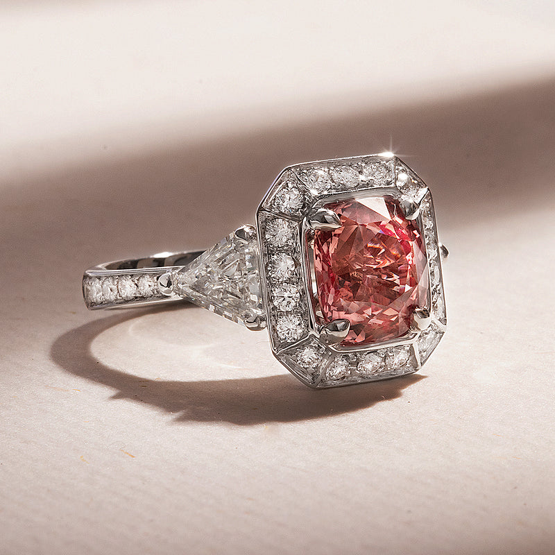 The Monument Trilogy Sapphire Ring features a rare Padparadscha, a sunset-hued variety of corundum (the mineral family of Sapphires and Rubies) — a queen of sorts in the gemstone world, and incredibly sought after by collectors and jewellery connoisseurs. This ring is a part of our Sapphire Signatures, a collection of 18K solid gold rings that feature incredibly rare, untreated Natural Sapphires handpicked by B.P. de Silva Gem Specialists.