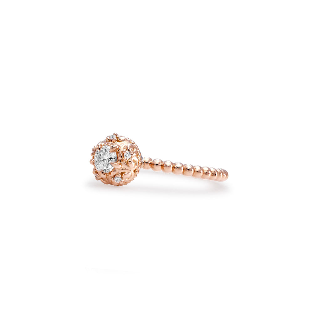 Our iconic Lovedrops™ Collection was born of a creative collaboration between our Designers in New York and Singapore. It took over a year of refining the intricate filigree and proportions that make each Lovedrops keepsake irresistibly tactile. Each fine jewel is crafted to be held, remembered and moved with. The Lovedrops Dainty Diamond Ring makes an idyllic alternative engagement ring worn alone, or a scintillating statement when stacked. CRAFTSMANSHIP DETAILS 0.26ct round brilliant centre Diamond. Sur