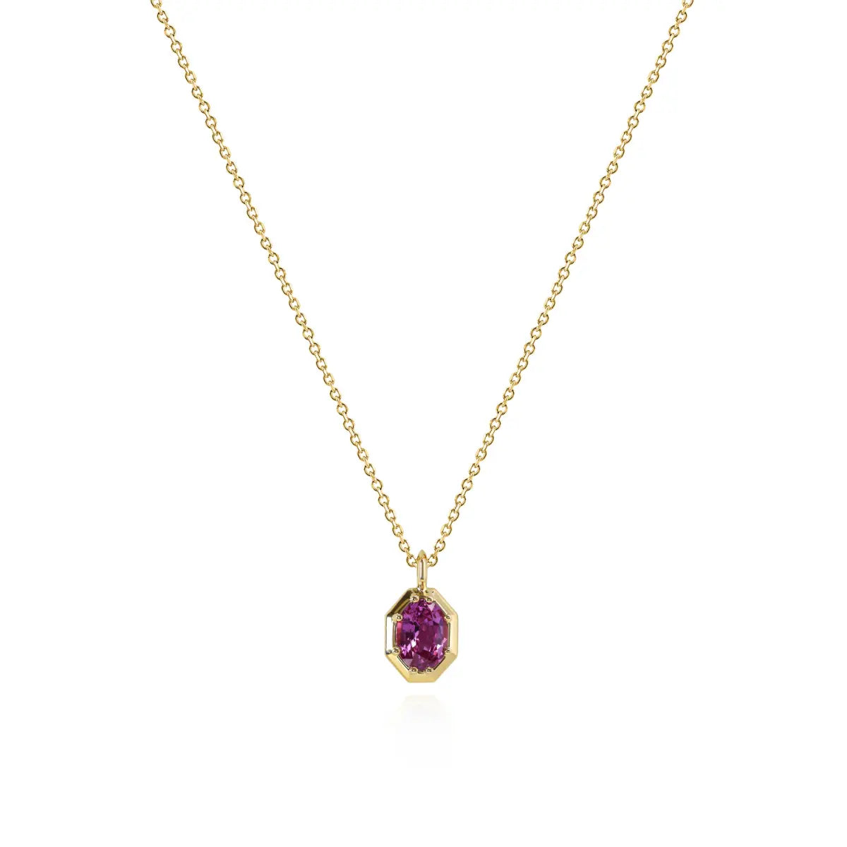 Gold necklace with pink faceted pendant on a thin chain