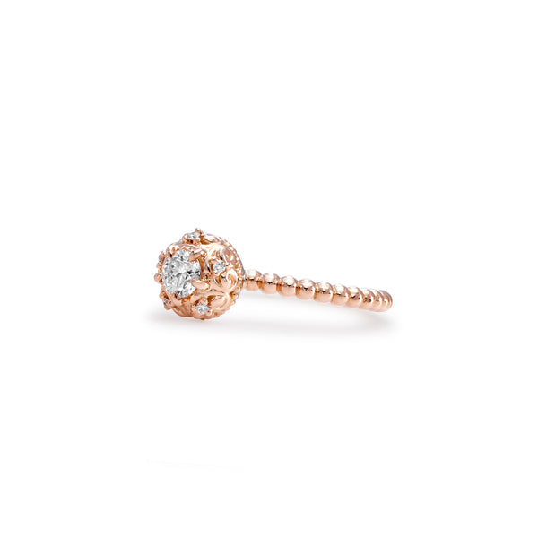 Our iconic Lovedrops™ Collection was born of a creative collaboration between our Designers in New York and Singapore. It took over a year of refining the intricate filigree and proportions that make each Lovedrops keepsake irresistibly tactile. Each fine jewel is crafted to be held, remembered and moved with.  The Lovedrops Dainty Diamond Ring makes an idyllic alternative engagement ring worn alone, or a scintillating statement when stacked.  CRAFTSMANSHIP DETAILS 0.26ct round brilliant centre Diamond. Sur