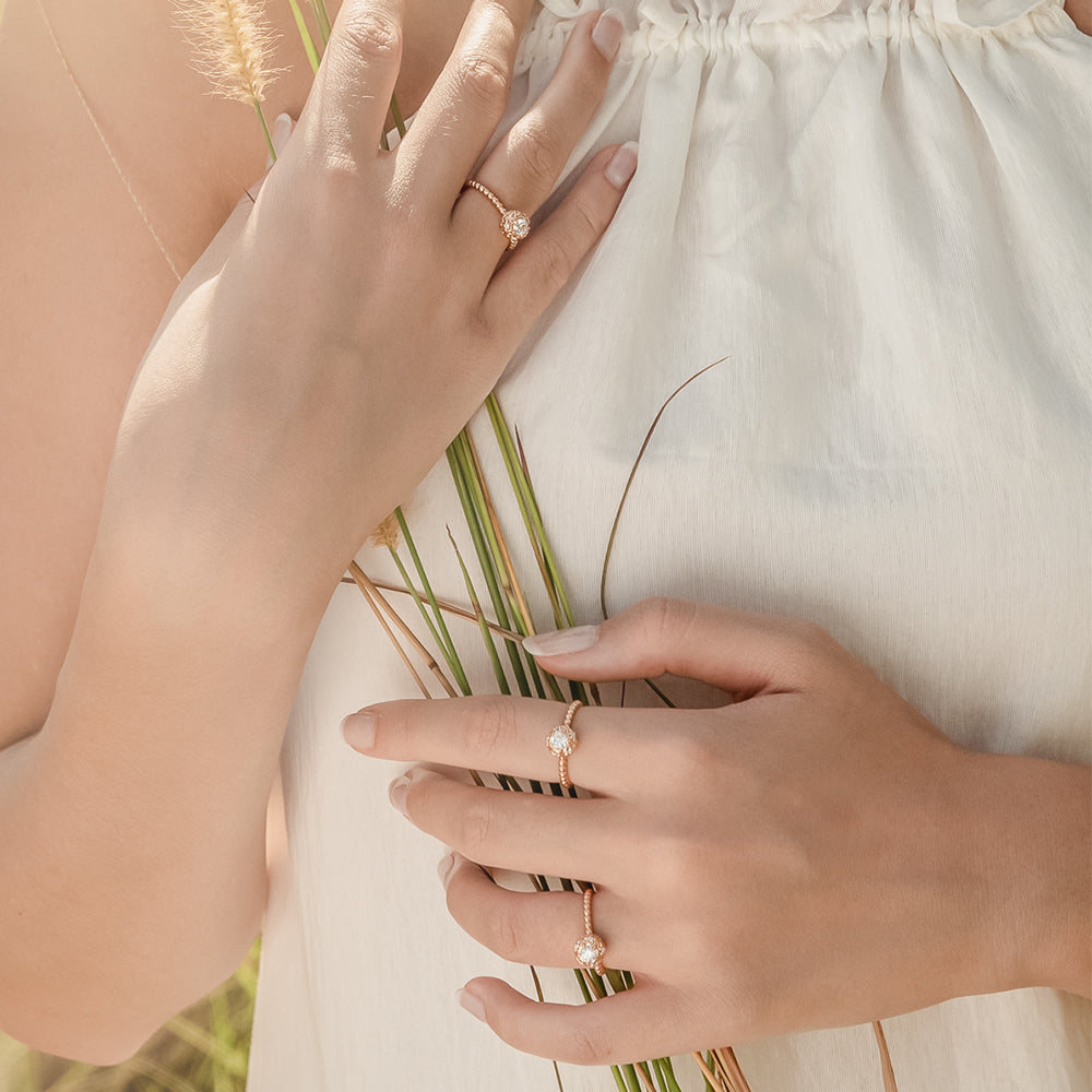 Our iconic Lovedrops™ Collection was born of a creative collaboration between our Designers in New York and Singapore. It took over a year of refining the intricate filigree and proportions that make each Lovedrops keepsake irresistibly tactile. Each fine jewel is crafted to be held, remembered and moved with.  The Lovedrops Dainty Diamond Ring makes an idyllic alternative engagement ring worn alone, or a scintillating statement when stacked.  CRAFTSMANSHIP DETAILS 0.26ct round brilliant centre Diamond.
